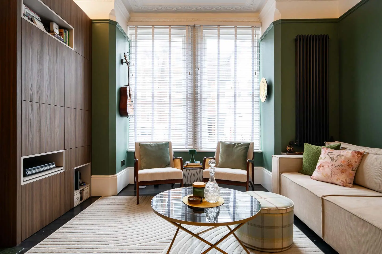 Full-height timber panelling in the front room, against the original bay window.